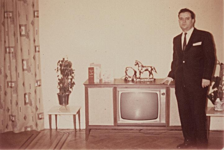 o04b.jpg - Dad and our console TV-stereo-radio, 1963.