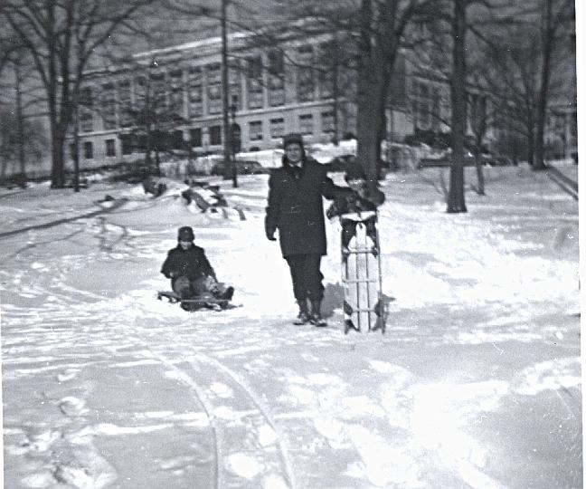 o09e.jpg - Sledding down the three slopes of the former PS 170 (Grammar School), the winter of 1964