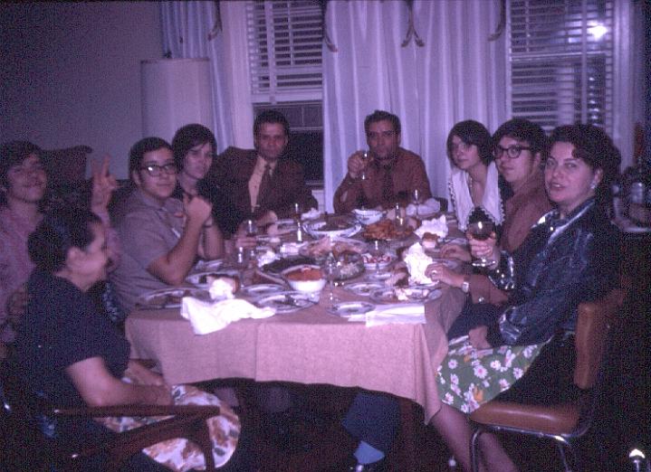 s009.jpg - A family dinner, Grandmother Chrissoula, cousin Louis, George, Aunt Voula, Uncle Antoni, Dad, cousin Chrissoula, Louis, and Mom, Nov. 1970.