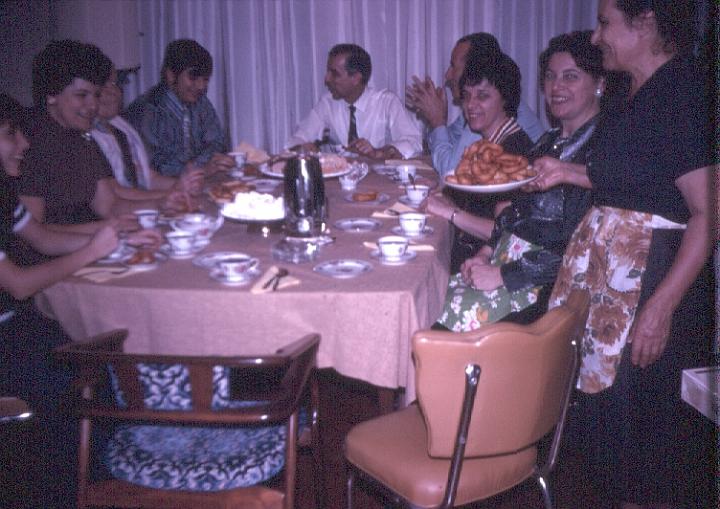 s010.jpg - A family dinner, cousin Chrissoula, Aunt Pauline, giagia Kiki, Greogory, Uncle John, Uncle Jim, Aunt Betty, Mom, giagia Chrissoula, Nov 1970.