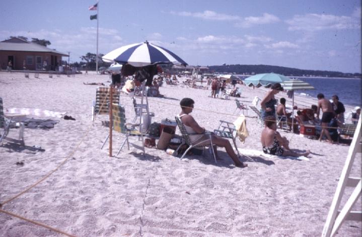 s018.jpg - Family outing to the beach with the famous blue and white beach umbrella, Summer 1970.