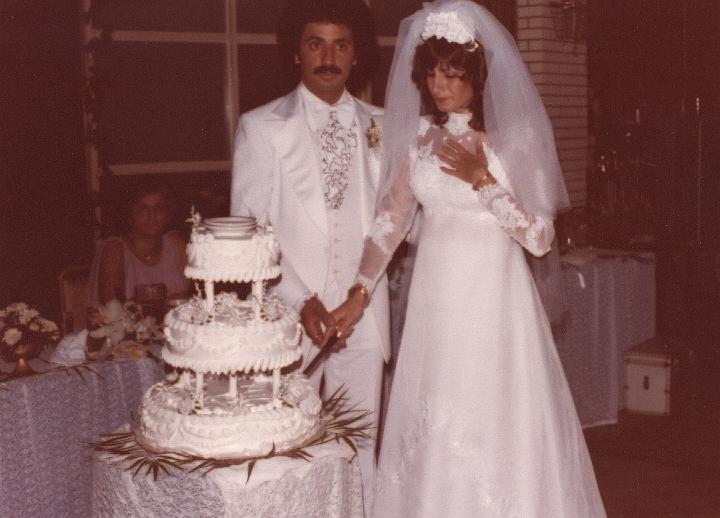 p032.jpg - Costa and my cousin Joanne cutting their wedding cake July 1978.