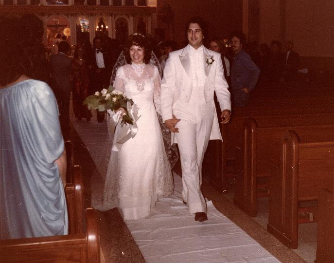 p065.jpg - Litsa and Paul walking down the aisle. October 14, 1979.