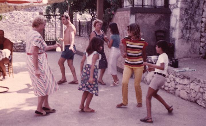 p126.jpg - Mom dancing with the children, 1981.