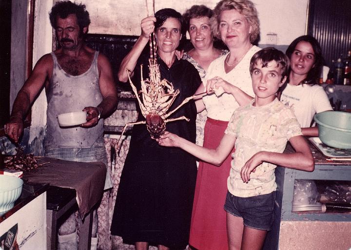 p128.jpg - Today's catch in Kokkala, 1981.Theia Maria and her daughter Euaggelio are holding the lobster.