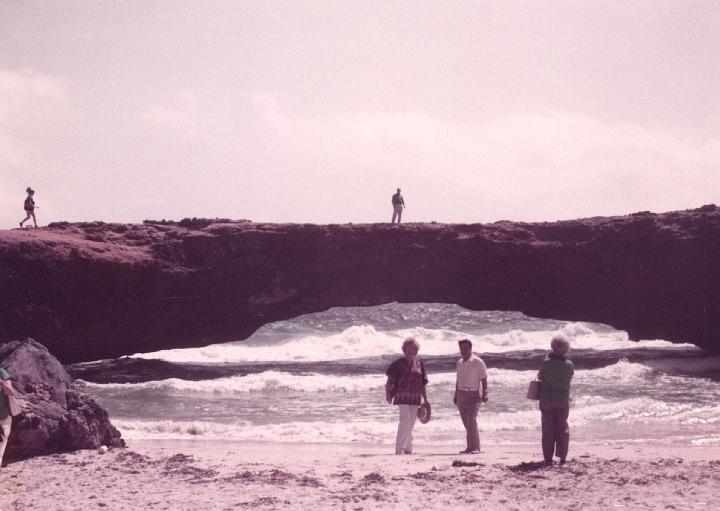 r028.jpg - Mom and Dad underneath a natural bridge in Acapulco, Mexico, Oct. 1983.