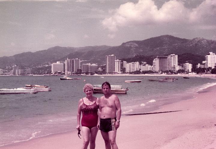 r051.jpg - Mom and Dad on the beach in Acapulco, Mexico, Oct. 1983.