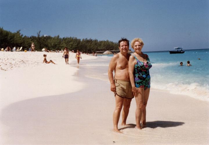 r129.jpg - Dad and Mom on the beach in Paradise Island, Bahamas, 1991.