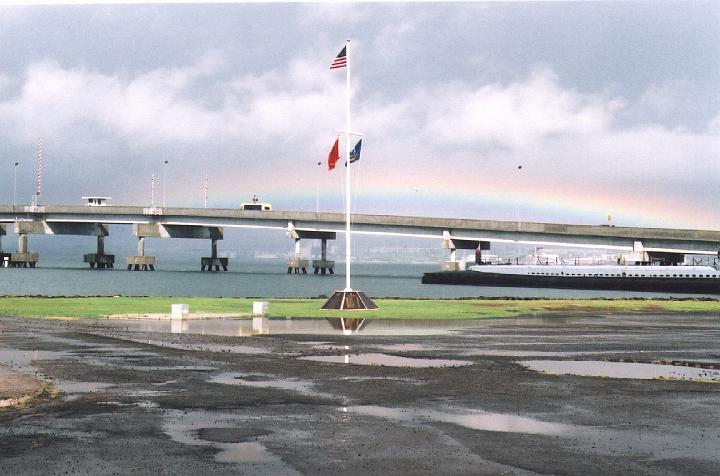 h105.jpg - Rainbow over bridge leading to Ford Island. The USS Bowfin Submarine on the right at Pearl Harbor.