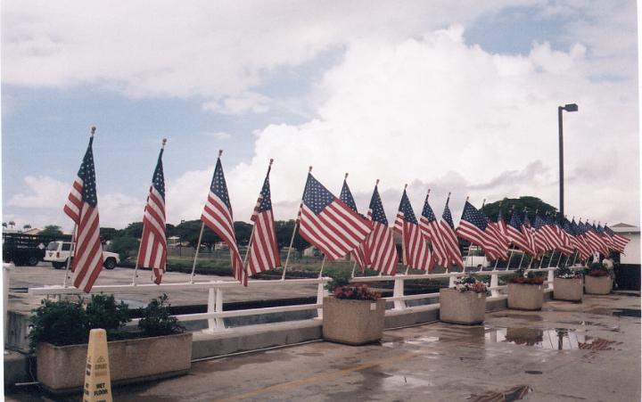 h111.jpg - US flags after the rain at Pearl Harbor.