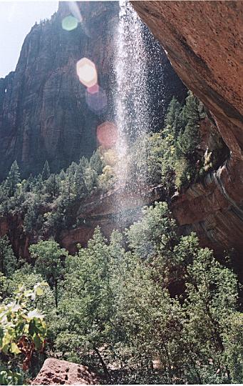 z14.jpg - A waterfall glistening in the sun on the trail to the Emerald Ponds.